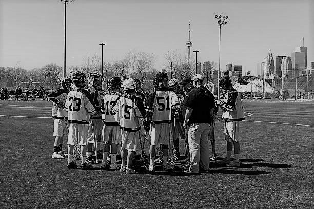 "Toronto, Canada - April 07, 2012: Hamilton high school lacrosse players taking the last tactics from their coach's before The Jammer Classic Lacrosse Tournament match in Cherry Beach Sports Fields in Toronto."